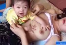 Breastfeeding Putting on Pajmma and Baby baby breastfeeding milk mama