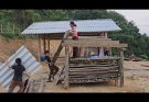 The process of building a wooden chicken house and the hard-working boy