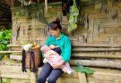 Single mother harvests bananas to sell